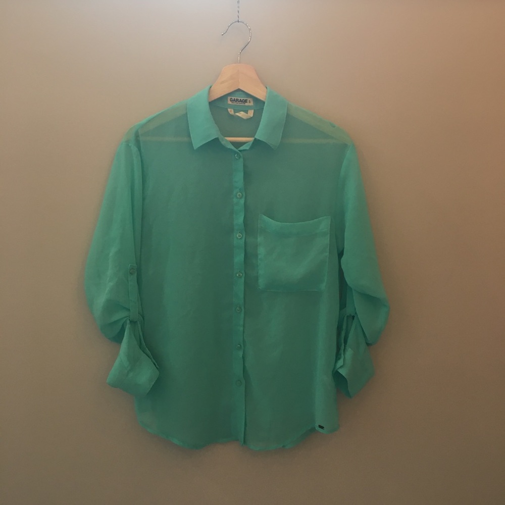 Cute turquoise transparent shirt.